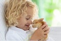 Child with rabbit. Easter bunny. Kids and pets Royalty Free Stock Photo