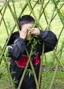 Child playing with willow