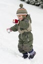 Child playing in winter snow