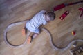 Child playing with wooden toy train Royalty Free Stock Photo