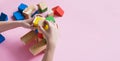 A child plays assemble with wooden cubes constructor. Education concept for children learning. Children`s toys Royalty Free Stock Photo