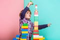 The child plays with colorful plastic toy bricks on the table. Boy playing with construction blocks at kindergarten Royalty Free Stock Photo