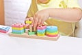 The child plays with colorful toy blocks. eco wooden toys. Little smart child playing natural toys. games for early Royalty Free Stock Photo