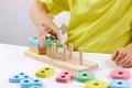 The child plays with colorful toy blocks. eco wooden toys. Little smart child playing natural toys. games for early Royalty Free Stock Photo