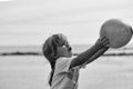 Child plays. Cute baby boy holds violet toy balloon in hands Royalty Free Stock Photo