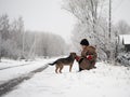 The child plays with the dog Royalty Free Stock Photo