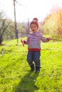 A child plays with a Frisbee outdoors. Royalty Free Stock Photo