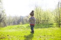 A child plays with a Frisbee outdoors. Royalty Free Stock Photo