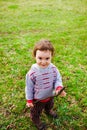 A child plays with a Frisbee outdoors. Royalty Free Stock Photo