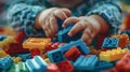 The child plays with Lego constructor
