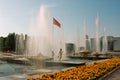 Child plays with mother under spray of a fountain Royalty Free Stock Photo