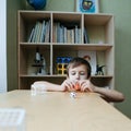 The child plays table football on the desk. Royalty Free Stock Photo