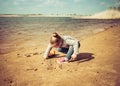 Child plays with toy car truck on the beach Royalty Free Stock Photo