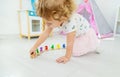 A child plays with a train made of numbers. Selective focus. Royalty Free Stock Photo
