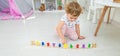 A child plays with a train made of numbers. Selective focus. Royalty Free Stock Photo
