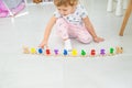 A child plays with a train made of numbers. Selective focus. Royalty Free Stock Photo