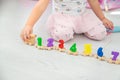 A child plays with a train made of numbers. Selective focus. Royalty Free Stock Photo