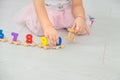 A child plays with a train made of numbers. Selective focus. Royalty Free Stock Photo