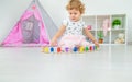 A child plays with a train made of numbers. Selective focus. Royalty Free Stock Photo