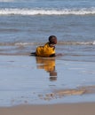 Child plays in the waves at Second Beach, Port St Johns on the wild coast in Transkei, South Africa.