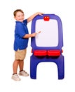 Child pointing at dry erase board