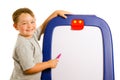 Child pointing at dry erase board