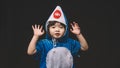 Child portrait with baby shark costume in studio