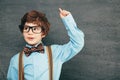 Child portraitCheerful smiling little boy against  chalkboard. Looking at camera. School concept Royalty Free Stock Photo