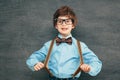 Child portraitCheerful smiling little boy against  chalkboard. Looking at camera. School concept Royalty Free Stock Photo