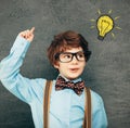 Child portraitCheerful smiling little boy against  chalkboard. Looking at camera. School concept Royalty Free Stock Photo