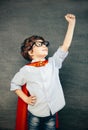 Child portraitCheerful smiling little boy against  chalkboard. Looking at camera. School concept Royalty Free Stock Photo