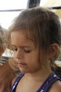 Child portrait of cute blonde little girl with disheveled messy hair. Sadness concept Royalty Free Stock Photo