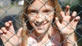 Child Portrait Smiling by School Metallic Fence, Happy Little Girl Face Laughing Royalty Free Stock Photo