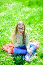 Child posing with cardboard eyeglasses for photo session at meadow. Girl on cheerful face spend leisure outdoors. Smart Royalty Free Stock Photo