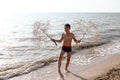 Child posing with tumbleweed plant on beach of Azov sea Royalty Free Stock Photo