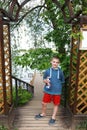 Child posing on wooden staircase to lake Seliger Royalty Free Stock Photo