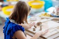 Child at pottery wheel. Kids arts and crafts class Royalty Free Stock Photo
