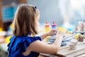 Child at pottery wheel. Kids arts and crafts class