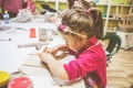 Little Girl At Pottery Workshop Working With Clay