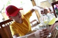 Child pouring lemon juice