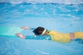 Child practice swimming by floating foam Royalty Free Stock Photo