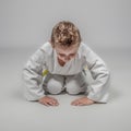 Child practicing martial arts in rei position