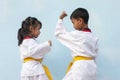 Child is practicing taekwondo.