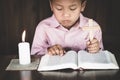 Child praying for christian religion,The boy who intended on the cross, Religion concept