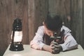 Child praying, Little childs hands holding wooden cross