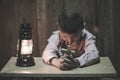 Child praying, Little childs hands holding wooden cross Royalty Free Stock Photo