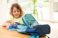 Child preparing to shool and doing his bag Royalty Free Stock Photo