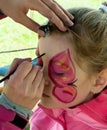 Child preschooler with face painting