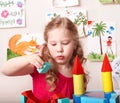 Child preschooler play wood block.