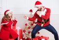 Child pretend to fight for christmas gifts. Christmas games. Make it fun. Kid cute girl play with father near christmas